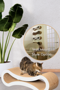 Brown tabby cat scratching on a sculptural PetFusion Ultimate Cat Scratch Lounge with curved cardboard design, next to a plant in a white pot. Inset shows wall-mounted installation option in a modern living room.
